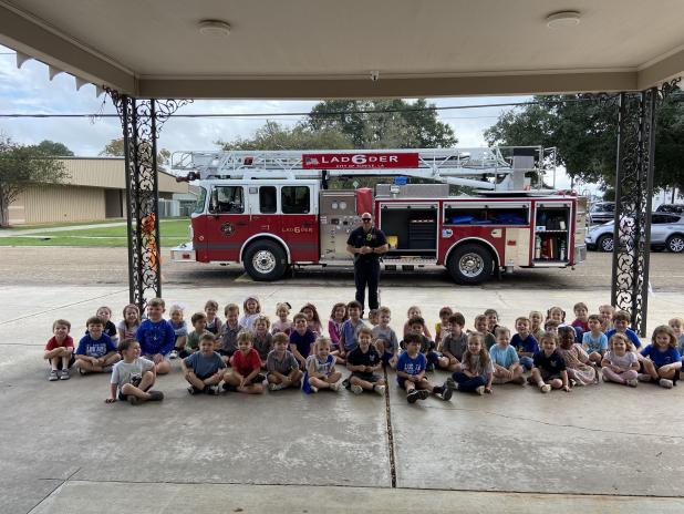 Christian Walker, St. Edmund Class of 2014, a fire prevention officer for the Eunice Fire Department spoke to the Pre-K3 and Pre-K4 St. Edmund Elementary students about the big red fire truck, fire safety, how fire fighters save people from fires, and procedures to stop fires from spreading. (Submitted photo)
