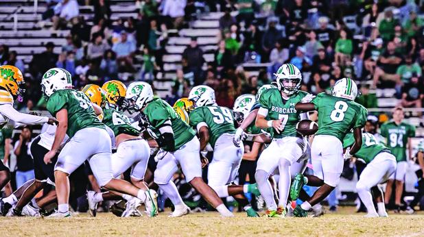 Eunice High’s quarterback Montana Brown goes for the ball to make yardage against Washington-Marion Friday evening. (Photo by Dwight Jodon)
