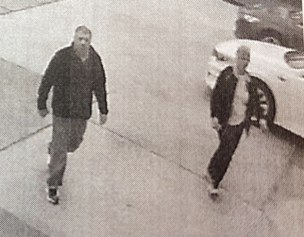 Surveillance image of two people suspected of Cadillace Deville sedan in Crowley. (Photo released by Acadia Crime Stoppers)