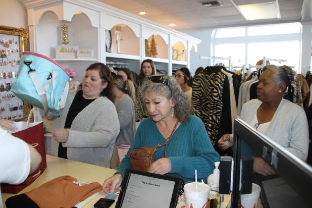 Large crowds shopped in Eunice Saturday for the annual Noel on the Prairie. Forming lines and checking out merchandise was this scene at Gossip Clothing Boutique.