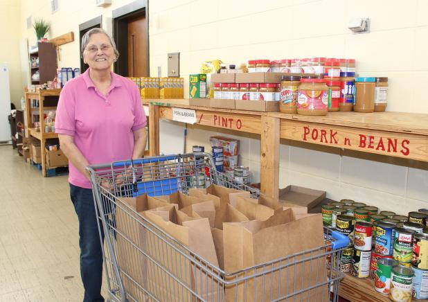 Cynthia Tanner, a volunteer for many years at the Eunice Food Bank, is pictured at the  Eunice Food Bank. The annual Eunice Food Bank Food Drive is set for Dec. 9 from 6 a.m. until 6 p.m. (Photo by Myra Miller)