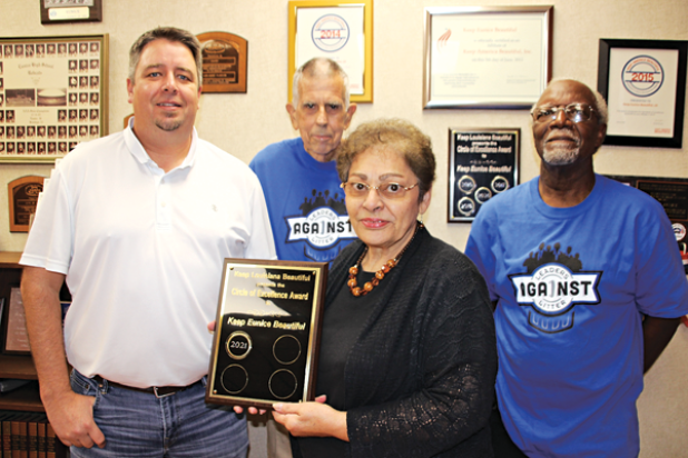 The City of Eunice received the Keep Louisiana Beautiful Circle of Excellence award. The plaque of recognition was presented to Mayor Scott Fontenot by Donna Baltakis, director of Keep Eunice Beautiful. From left, are Fontenot, David Simpson, Baltakis, and Mark Dupre. Simpson and Dupre are on the board of directors of KEB. Keep Louisiana Beautiful also awarded the city six wall mount cigarette ash receptacles. (Photo by Myra Miller)
