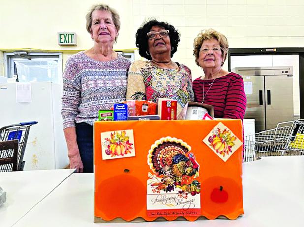 Beta Sigma Phi Sorority donated canned goods and presented a monetary donation to Mary Ann Guillory, director at the Eunice Food Bank.