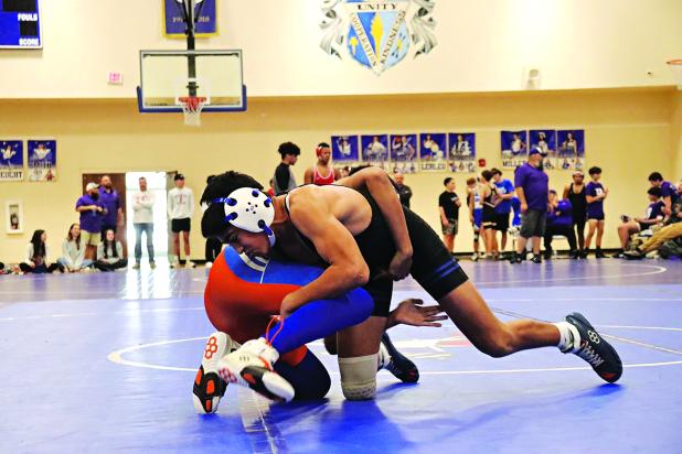 Zander Langlinais of St. Edmund defeating a St. Louis Catholic team member. (Photo by Amy Myers)