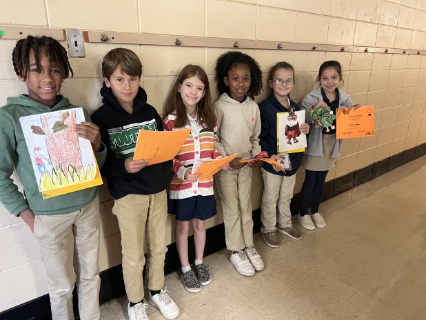 Third graders at East show off their disguised turkeys