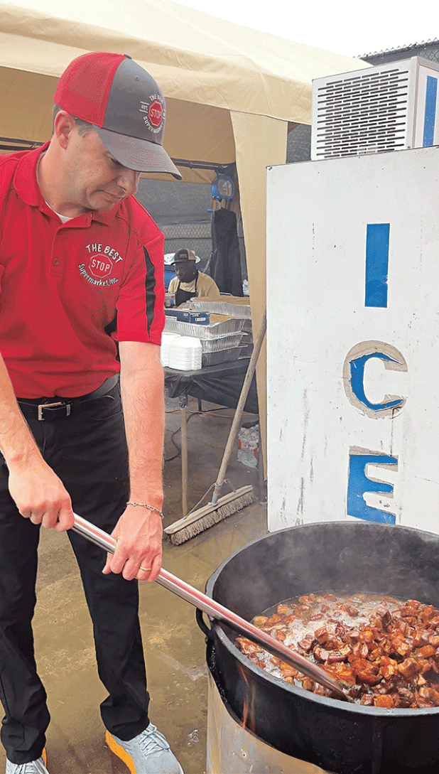 Damon Cormier of The Best Stop was a vendor at the annual Scott Boudin Festival, serving specialty Cajun foods like boudin and cracklins. (Photo by Layne Miller/LSU Manship School News Service) 