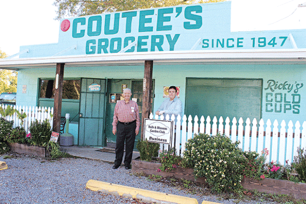 Coutee’s Grocery received the Bulb & Blossom Garden Club Business of the Month in December 2022. Joe Coutee Jr. and Ricky Coutee are pictured. (Photo by Myra Miller)