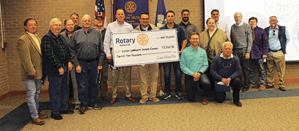 The Eunice Rotary Club presented a $2,200 check to Glyn Michaud, pharmacist at the Eunice Community Health Center, to help defer the cost of the replacement of the front glass doors of the center that were vandalized. From left, are Donnie Richard, John Fontenot, Jerome Fontenot, David Clause, Bob Soileau, David Reed, Kip Bertrand, Michaud, Coby Clavier, Jacob Bergeron, the Rev. Andrew Bates, Shirley Vige, Pat Dossman, John Hamlin, Don Mayeux, Ellis Daigle and Randall Vigee. (Photo by Myra Miller)