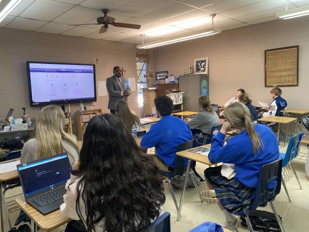 Floyd Collin Henry, ASVAB career exploration program manager, assisted St. Edmund students with interpreting their vocational aptitude battery results.