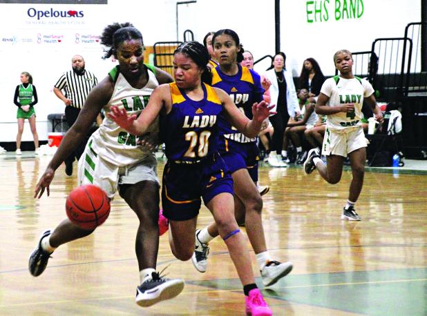 Sophomore guard Cayli Lemelle dribbles past a defender in Tuesday’s win over Opelousas Catholic. She was crucial down the stretch, finishing with eight points all scored in the second half. (Photos by Rhett Manuel)