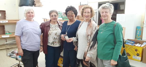 Bulb & Blossom Garden Club donates check to Eunice Food Bank.