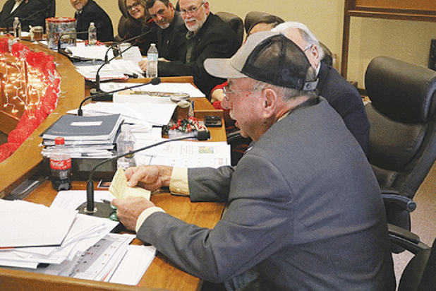 Evangeline Parish Police Juror from District 2 Sidney Fontenot reads the engineer’s report en français for parish engineer Ronnie Landreneau during the French meeting held Dec. 12. (Ville Platte Gazette photo by Tony Marks)