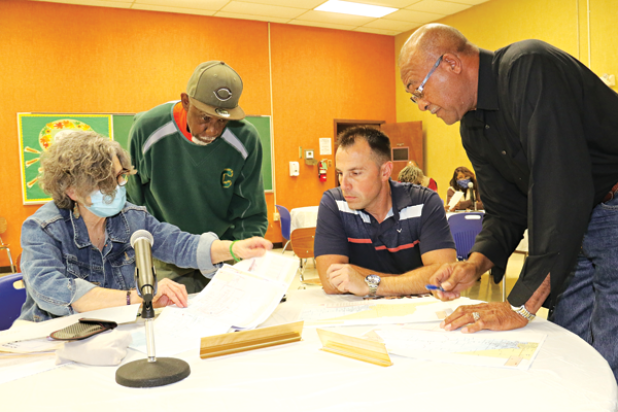 St. Landry Parish School Board and Parish Council member met Monday at the School Board Resource Center in Opelousas to work on district lines with demographer Mike Hefner. The political lines are shifting after the census showed the parish lost population. From left, are Mary Ellen Donatto, Albert Hayes Jr., Coby Clavier and Jimmie Edwards. (Photo by Harlan Kirgan)