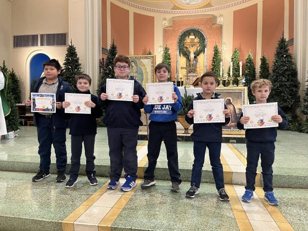 St. Edmund students were recognized after an All-School Mass for completing their first quest in the Boost Reading Intervention Program