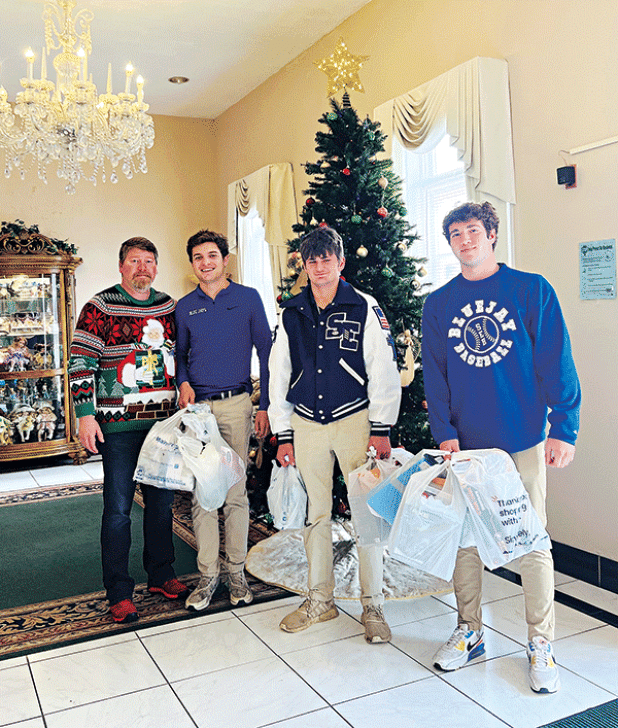 St. Edmund students participated in an Advent donation drive. St. Edmund selected several organizations they felt would benefit from the school’s generosity. Each grade level was assigned an organization to help. The classes not only brought in items from the suggested donation list to meet the recipients’ physical needs, but they most importantly lifted these people up in prayer to help meet their spiritual needs. From left are Rhett Wimberly, administrator at Oak Lane, J.P. Fruge, Zane Zaunbrecher and Kan