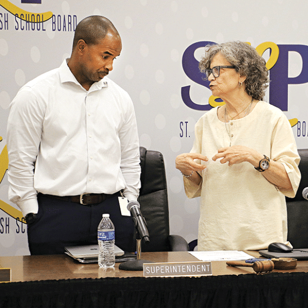 St. Landry Parish School Superintendent Milton Batiste, left, and School Board President Mary Ellen Donatto talk after Thursday’s School Board meeting in Opelousas. 