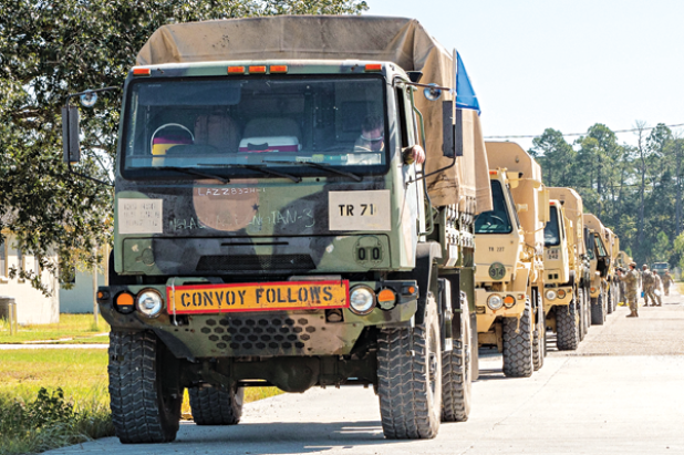 Nearly 70 Louisiana National Guardsmen assigned to the 1087th Transportation Company, 165th Combat Sustainment and Support Brigade, 139th Regional Support Group, prepare roughly 30 tactical vehicles to assist emergency operations in Florida after Hurricane Ian, Slidell, Sept. 29. (U.S. Army National Guard photo by Staff Sgt. Garrett Dipuma)