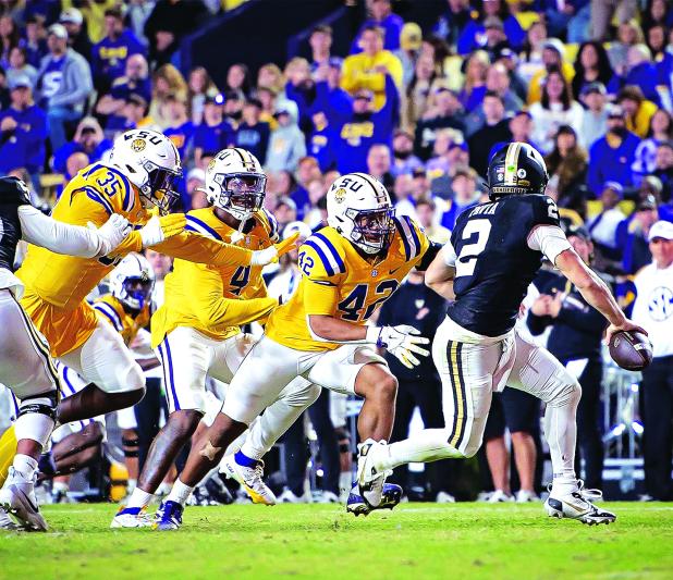 LSU defenders rush Vanderbilt quarterback Diego Pavia in the Nov. 23 contest in Baton Rouge. (Photos by Dwight Jodon)