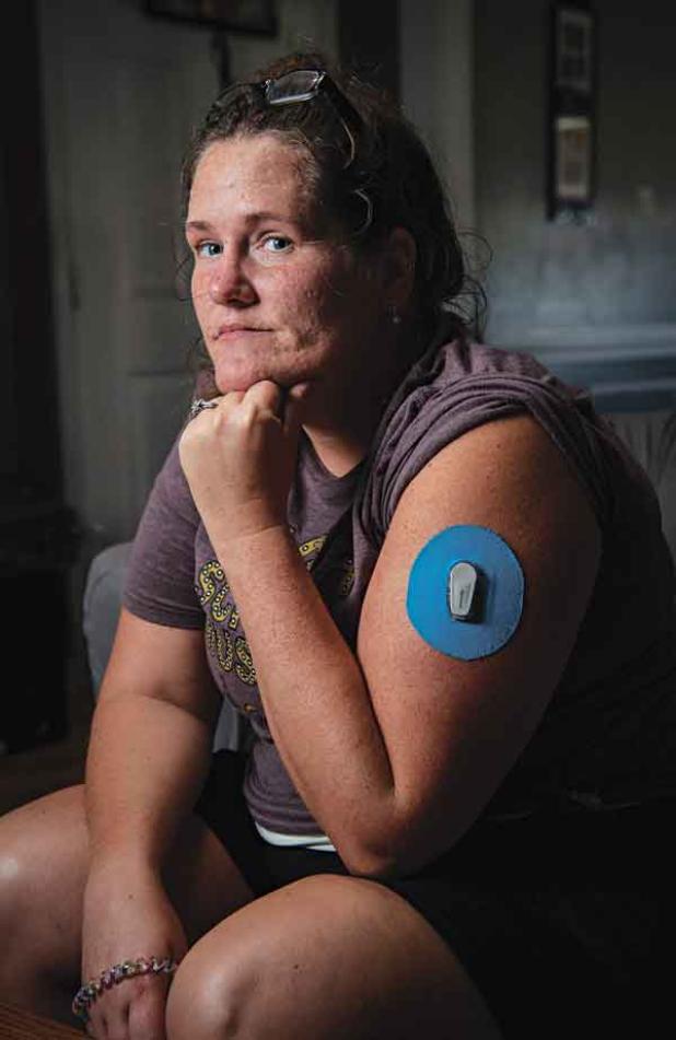 Courtney Massery sits for a portrait in her home in Ward, Arkansas. (Photo by Rory Doyle/Mississippi Center for Investigative Reporting) 