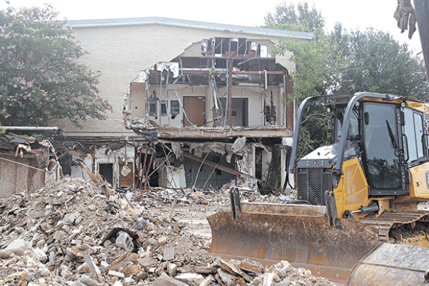 The entrance to the former Moosa Memorial Hospital has disappeared as demolition of the building progresses. The demolition is expected to take about three months to complete, according to St. Landry Parish President Jessie Bellard. (Photo by Harlan Kirgan)