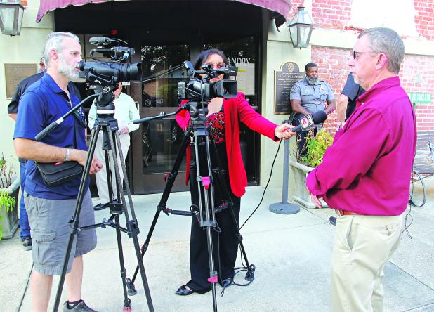 St. Landry Parish President Jessie Bellard, right, speaks to reporters after a special Parish Council meeting Tuesday in Opelousas. (Photo by Harlan Kirgan)