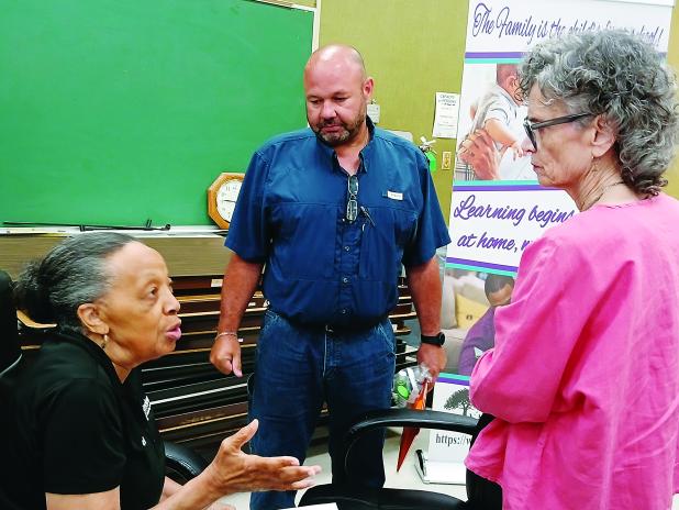 Board members Hazel Sias, Robert Gautreaux and Mary Ellen Donatto.