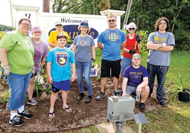 On Saturday, members of the Eunice Bulb and Blossom Garden Club added plantings around the Welcome to Eunice sign located on the west end of Laurel Avenue after giving the sign a thorough cleaning. The beautification project coincided with Saturday’s Citywide Cleanup organized by Keep Eunice Beautiful as the culminating activity of the statewide Love the Book Week. Earlier in the week, club members prepared the area Saturday’s planting. From left are club president April DeRouen, Jacquelyn Love with Levi Lo