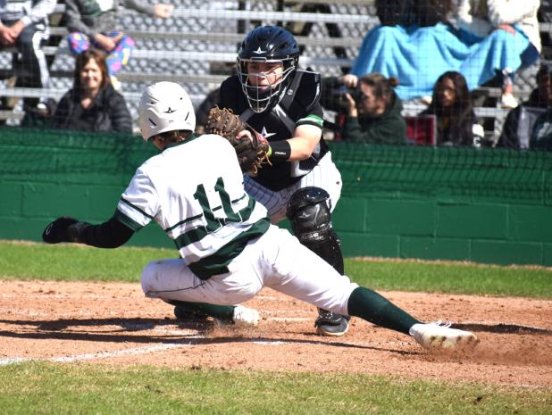 Eunice High catcher Payton Brown tags out Mamou’s Brady Fontenot during the Perry Pitre Ford jamboree. 