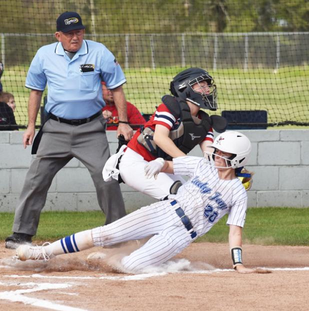 St. Edmund’s Caroline Lavergne slides past the tag of LCA catcher Kayden Hebert. (Photo by Tom Dodge)