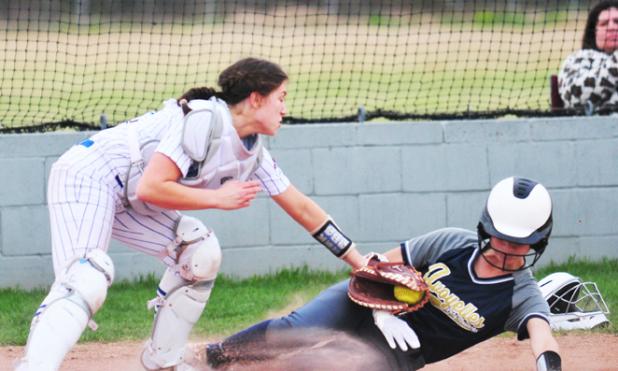 Alice Brown makes a tag at the plate.