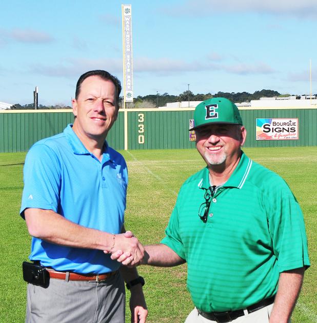 Washington State Bank’s Kip Bertrand joins Eunice High head coach Scott Phillips prior to the annual baseball tournment.
