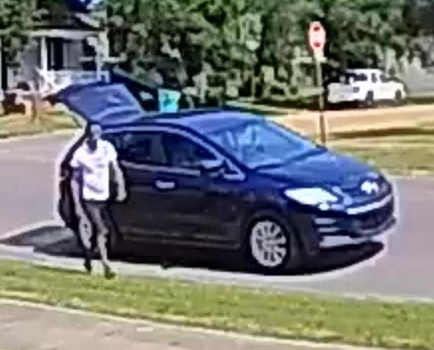 Suspect and vehicle in photo released by Eunice Police. 