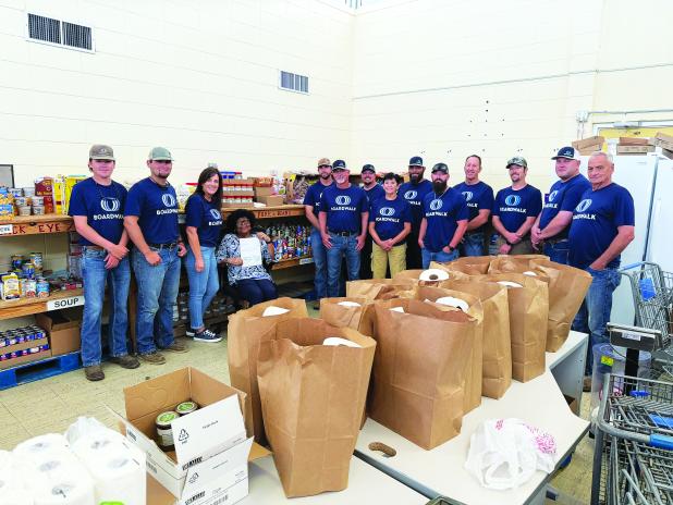 Boardwalk calls this their Week of Caring. They provide four hours of volunteer time with trusted nonprofit partners, offering a variety of ways to give back to the community. This is an annual event that Boardwalk plans to do for the Eunice Food Bank. (Photo by Rebecca Chaisson)