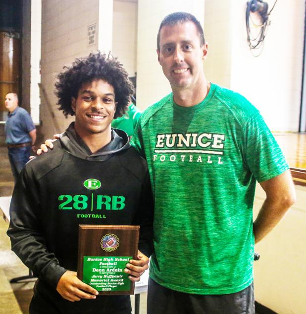 Eunice High head football coach Andre Vige presents the Jerry Hoffpauir Memorial Award to Deon Ardoin.