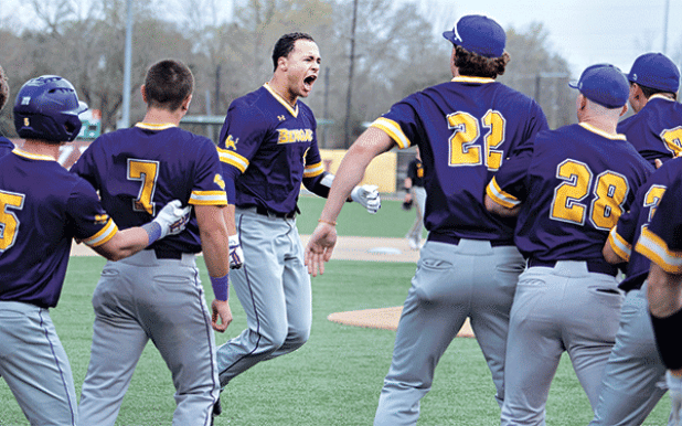 LSU Eunice celebrates with Cash Riley, center, after hitting the game winning grand slam vs. Tyler JC. (LSUE photo)