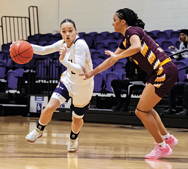 Simone Clay (25) dribbles past a defender in a recent home game for LSU Eunice Women’s Basketball. (LSUE photo)