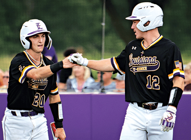 Will Mabry IV, right, congratulates Milan Obradovich after scoring an early run in LSUE’s win over Bossier Parish. (LSUE photo)