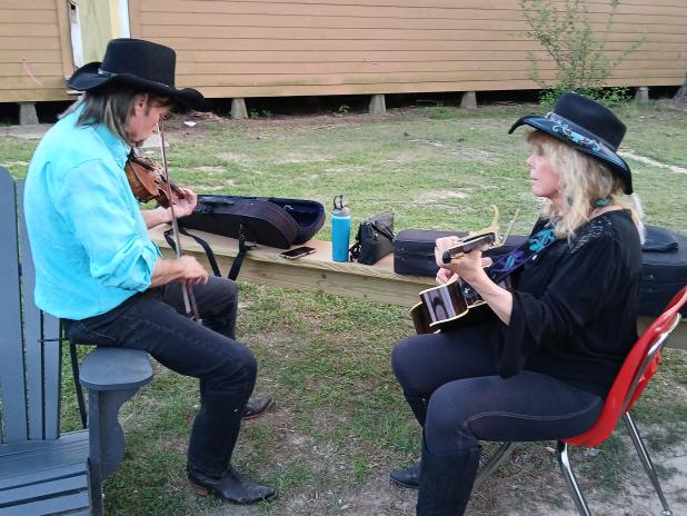 Pat and Cindy Onire of Mississippi, pictured left, playing their instruments during the celebration. The week was not only about music but also featured crafts, food, workshops and more. (Photo by Bobby Ardoin)