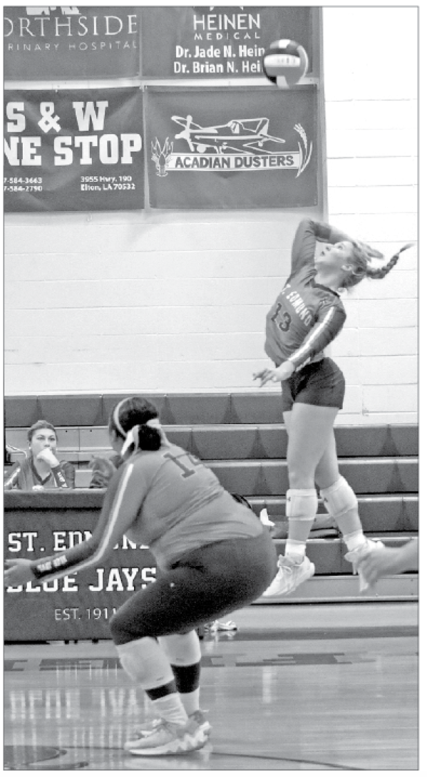 On Tuesday evening, the St. Edmund High volleyball team fell to Westminster Christian Academy Opelousas 15-25, 5-25, and 15-25. St. Ed senior Ava Smith goes for a spike during Tuesday’s loss to Westminster Christian Academy in district play. From left, are Reagan Gradney and Ava Smith. (Photo by Amy Myers)