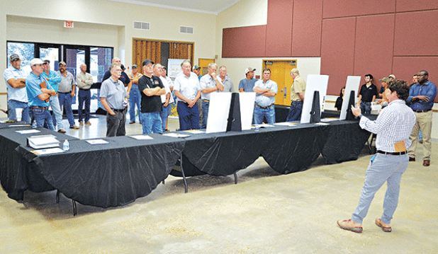 Andy Taylor, senior manager in development for Lightsource bp,addresses a larger-than-expected crowd of area farmers and citizens at the LSU AgCenter Building Wednesday concerning a proposed 1,100-acres solar farm to be located north of Crowley along La. 13. (Photos by Steve Bandy/Crowley Post-Signal)
