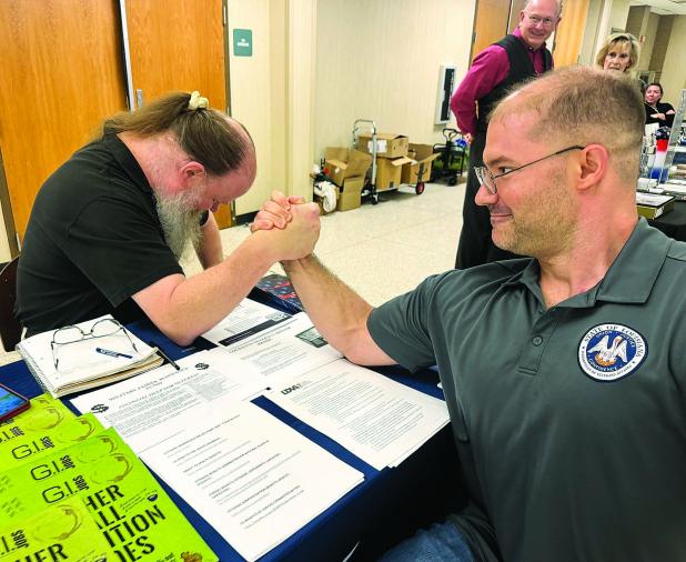 Veterans Marine Paul Ganucheau and Joseph Zetty of the Air Force participate in a little “sibling rivalry” at Vet Fest.