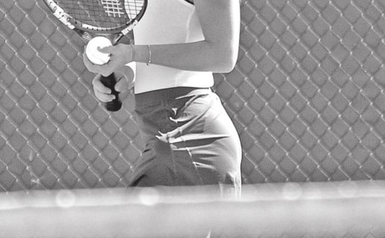 Susannah Summerlin serves the ball. (Photo by Tom Dodge