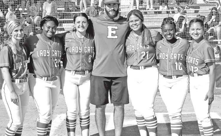 Eunice High softball recognized their seniors before Thursday’s game. From left, are Mallory O’Brien, Trinity Ned, Olivia Thibodeaux, coach Trenon Trosclair, Jailyn Pavich, McKenzie Guillory and Sydni Lemelle. (Photo by Tom Dodge)