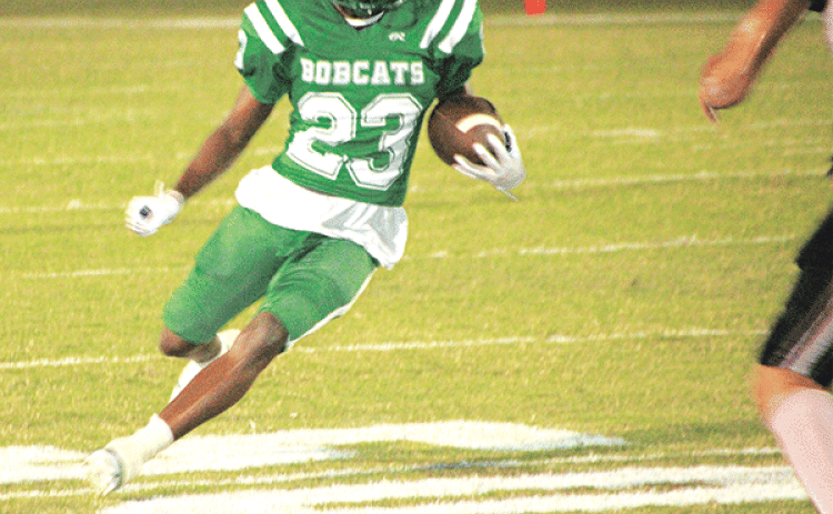Bobcat running back Malik Thomas looks for running room against Welsh. (Photo by Rhett Manuel)