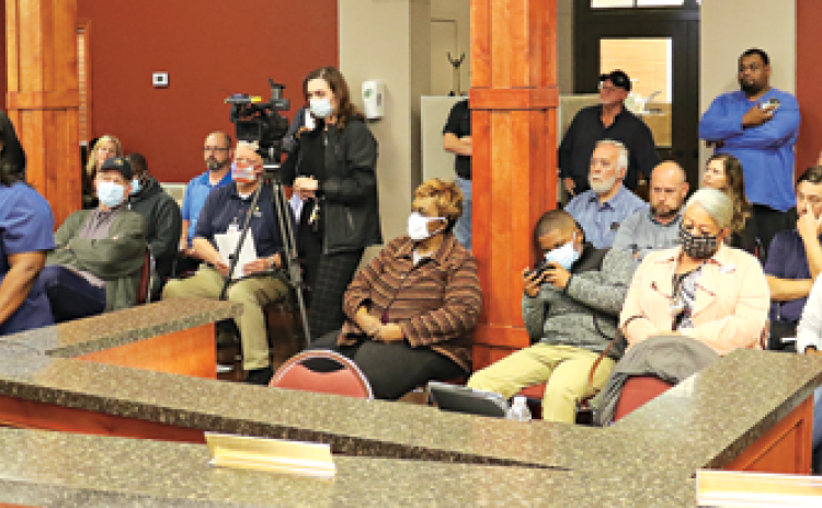 The audience at Wednesday’s St. Landry Parish Council meeting Opelousas was mostly filled with people interested in a barricade in a subdivision south of Opelousas. Speak, in blue, is Alexis Thomas of the subdivision. (Photo by Harlan Kirgan)
