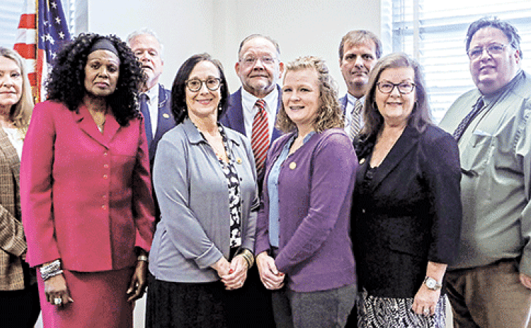 Acadia Parish Assessor James J. “Jimbo” Petitjean’s staff. Front, from left, are Nancy Hayes, Deborah Jackson, Lisa Faulk, Selina Myers, Cheryl Boudreaux and Joel O’Quain. Rear, from left, are Jeff Bourgeois, Jim Petitjean and Randy Guidry.(Submitted photo)