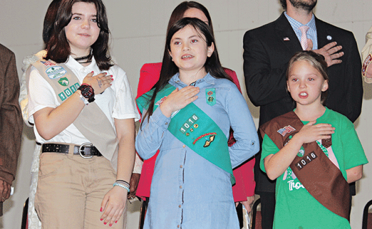 The Girl Scout Troop 1016 led the Pledge of Allegiance during the Inauguration Ceremony program held Thursday. From left, are London (L.J.) Hofstad, Ava Ortego and Kallie Bakka. Alderman Chad Andrepont is in the background.More photos on Page 10. (Photo by Myra Miller)