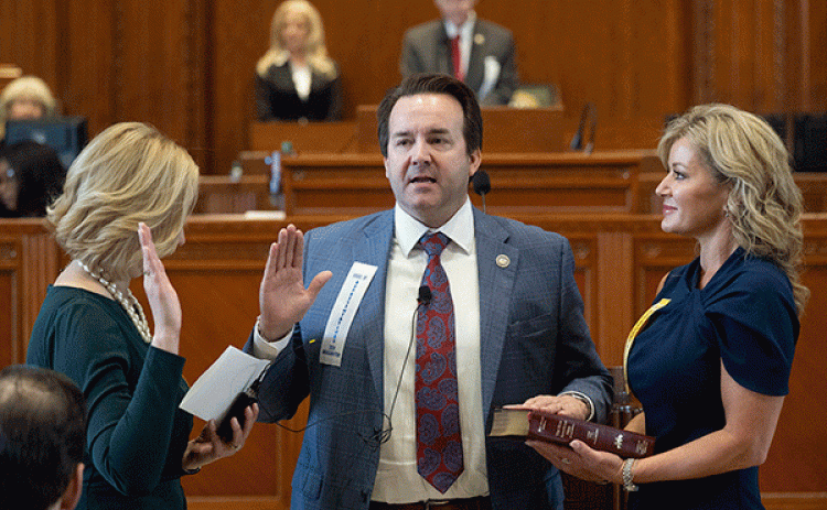 Rep. Phillip DeVillier, center, is sworn in as Speaker of the House by Clerk Michelle Fontenot, left, with his wife, Lisa DeVillier at right, on legislative Inauguration Day, Monday at the Louisiana State Capitol in Baton Rouge. (Hilary Scheinuk/The Advocate via AP Pool)