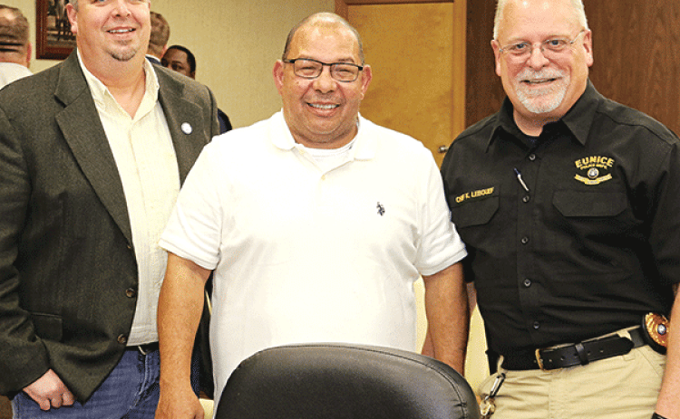 Eunice Pollce Deputy Chief Tony Kennedy, center, was recognized on his retirement at Tuesday’s Board of Aldermen meeting. From left, are Mayor Scott Fontenot, Kennedy, and Police Chief Kyle LeBouef. (Photo by Harlan Kirgan)