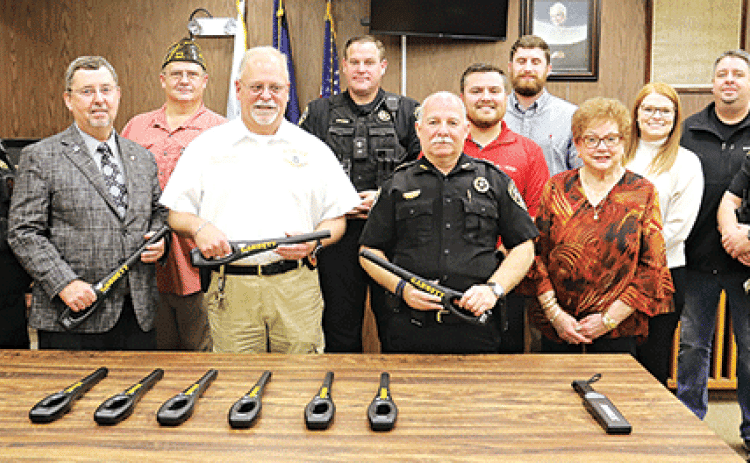 With hand-held scanners are officials and some of the donors who helped pay for the equipment. From left, are Deputy George Cain, Parish President Jesse Bellard, VFW Post Commander Donnie Fontenot, Police Chief Kyle LeBouef, Deputy John Medlin, City Marshal Terry Darbonne, Joseph Tuminaro of State Farm, Trey Ducote of State Farm, Evelyn Stringer of WoodmanLife Chapter 243, Caroline Frey of State Farm, Mayor Scott Fontenot and Chief Deputy Joey Peloquin. (Photo by Harlan Kirgan)